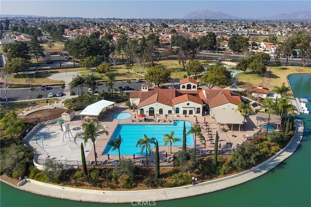 birds eye view of property featuring a water and mountain view