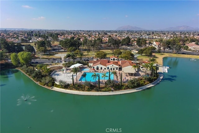 aerial view featuring a water and mountain view