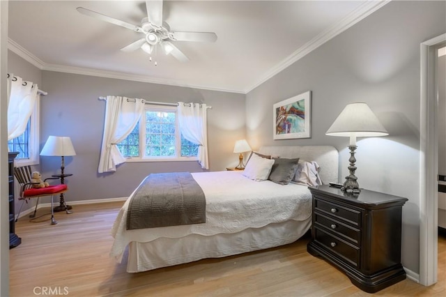 bedroom with crown molding, ceiling fan, and light hardwood / wood-style floors