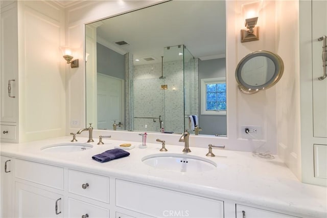 bathroom featuring crown molding, vanity, and walk in shower