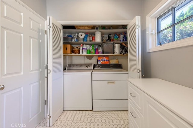 washroom with washing machine and dryer