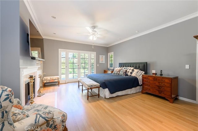 bedroom with access to exterior, crown molding, ceiling fan, and light wood-type flooring