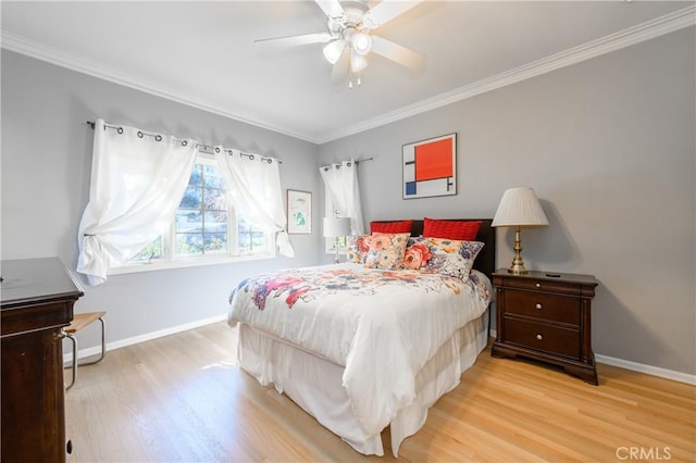 bedroom with crown molding, light hardwood / wood-style flooring, and ceiling fan