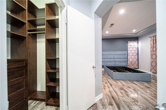 bathroom with wood-type flooring