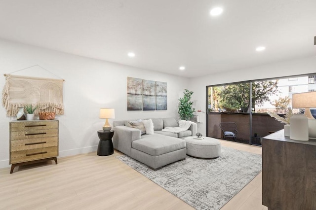 living room with light hardwood / wood-style flooring