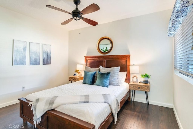 bedroom featuring dark hardwood / wood-style flooring and ceiling fan