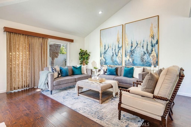 living room with wood-type flooring and vaulted ceiling