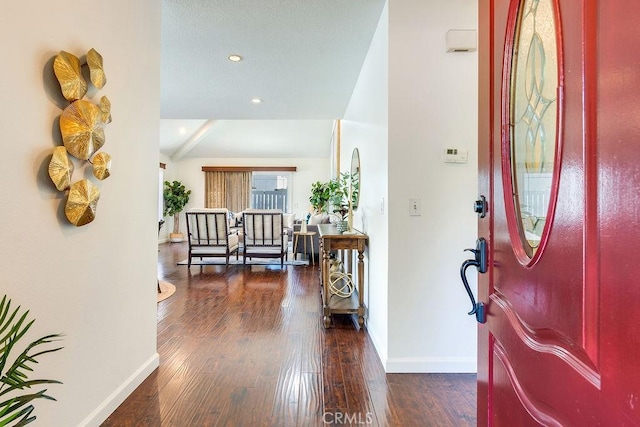 foyer with dark hardwood / wood-style floors