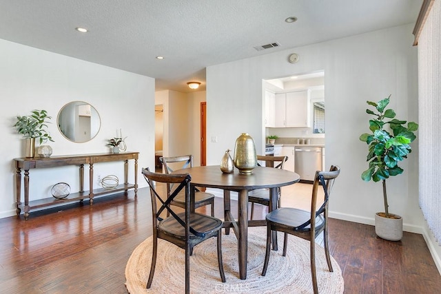 dining room with dark hardwood / wood-style floors