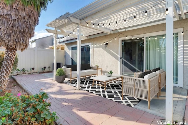 view of patio featuring an outdoor hangout area and a pergola