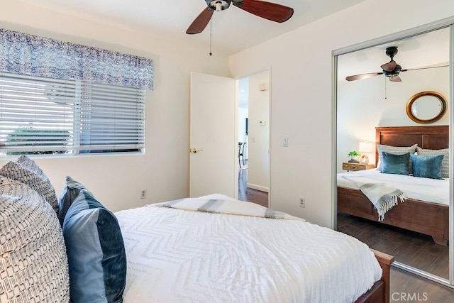 bedroom featuring dark hardwood / wood-style flooring and ceiling fan