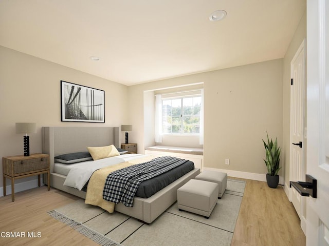 bedroom with light hardwood / wood-style flooring