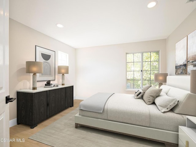 bedroom with light wood-type flooring