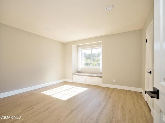 unfurnished room featuring light wood-type flooring