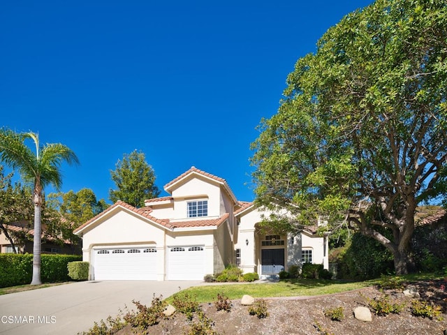 view of front of property with a garage