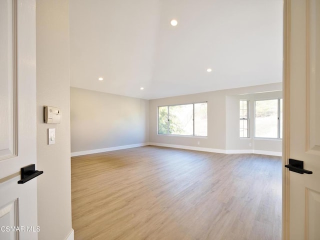 spare room featuring light hardwood / wood-style flooring