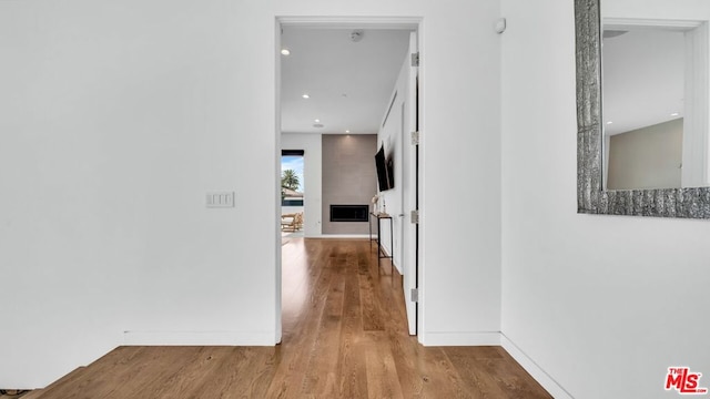 hall with wood-type flooring