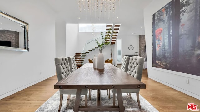 dining room featuring a chandelier and light hardwood / wood-style flooring