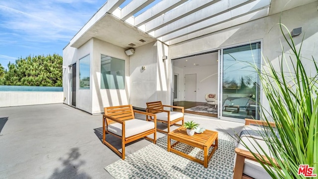 view of patio / terrace featuring an outdoor living space and a pergola