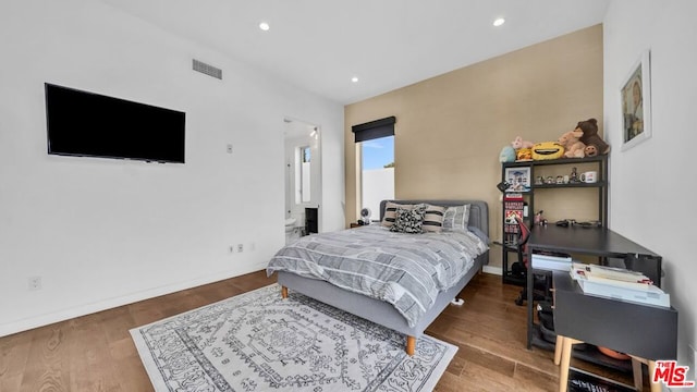 bedroom with wood-type flooring