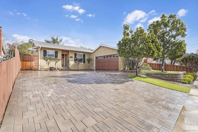 single story home featuring a garage