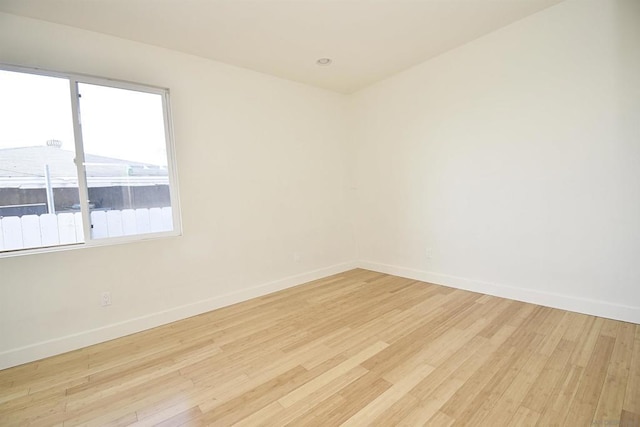 spare room featuring light wood-type flooring