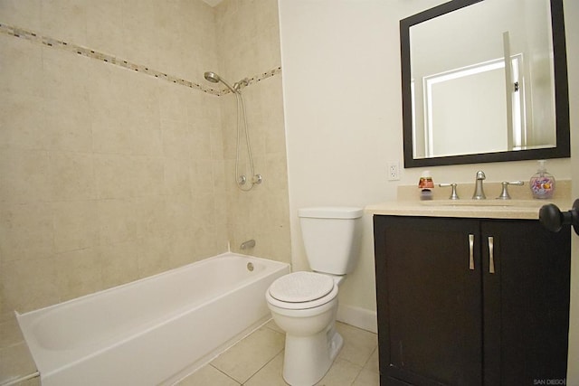 full bathroom featuring tiled shower / bath combo, vanity, tile patterned floors, and toilet