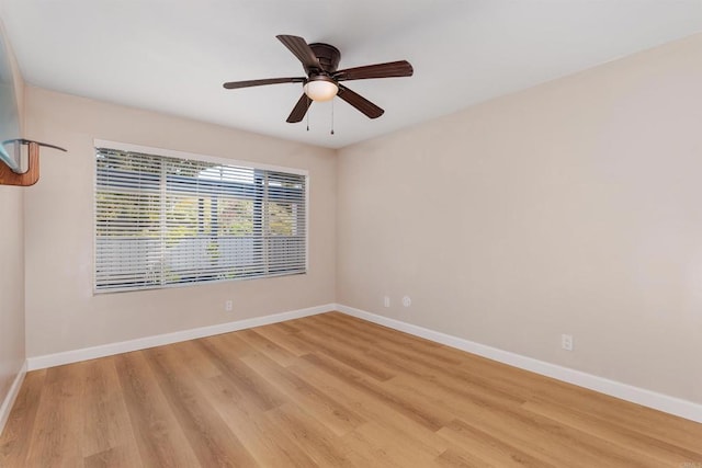 spare room featuring ceiling fan and light hardwood / wood-style flooring