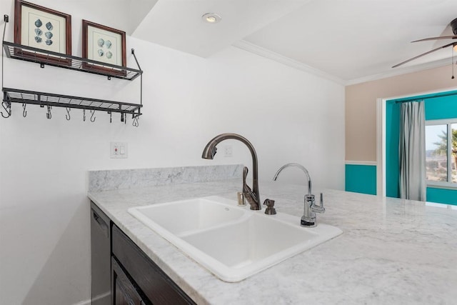 kitchen with sink, dishwasher, ceiling fan, ornamental molding, and light stone countertops