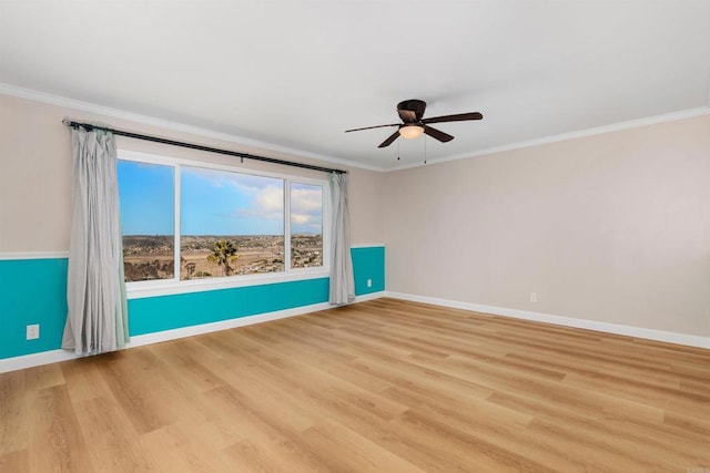 unfurnished room featuring crown molding, light hardwood / wood-style flooring, and ceiling fan