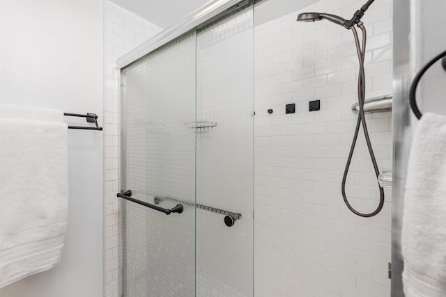 bathroom with a stall shower