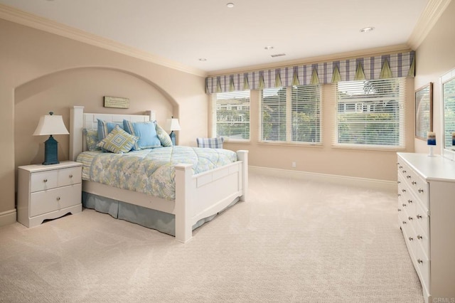 carpeted bedroom featuring crown molding