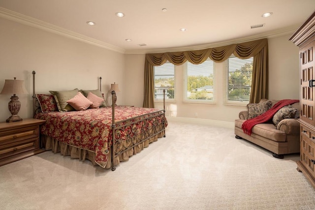 bedroom with multiple windows, crown molding, and light colored carpet