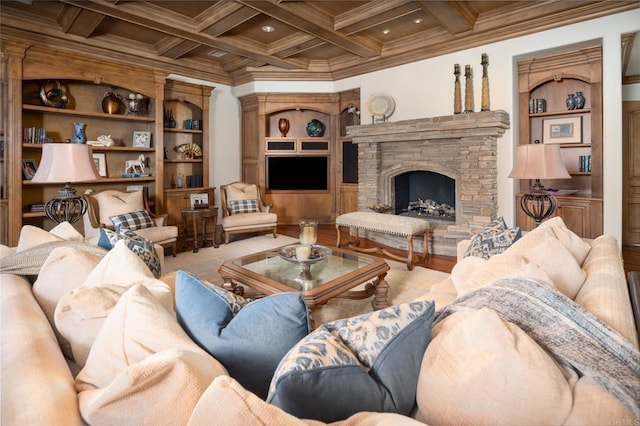 living room featuring built in shelves, coffered ceiling, crown molding, beamed ceiling, and a fireplace