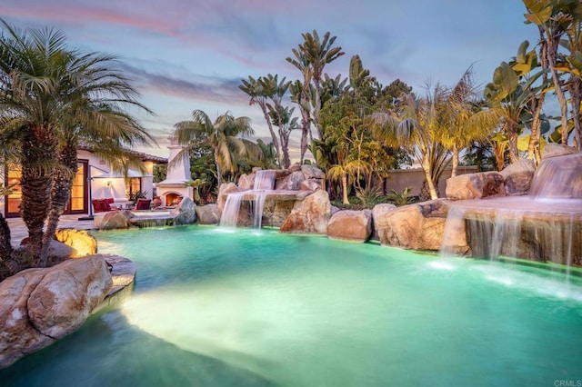 view of pool at dusk