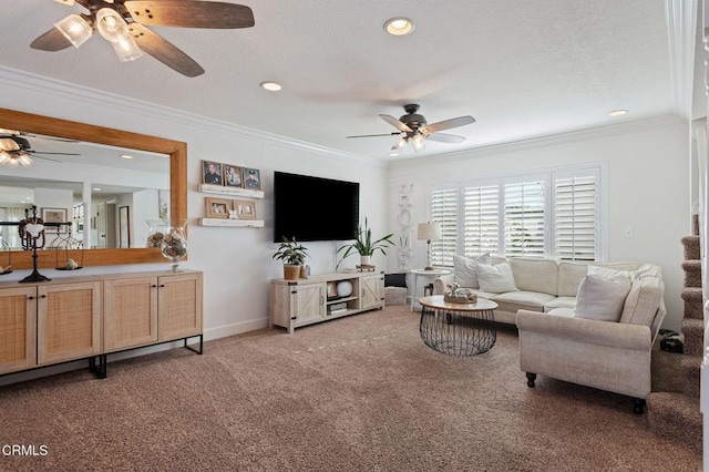 carpeted living room featuring ornamental molding and ceiling fan