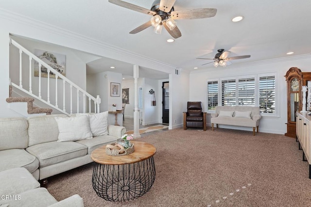 carpeted living room featuring ceiling fan, ornamental molding, and decorative columns