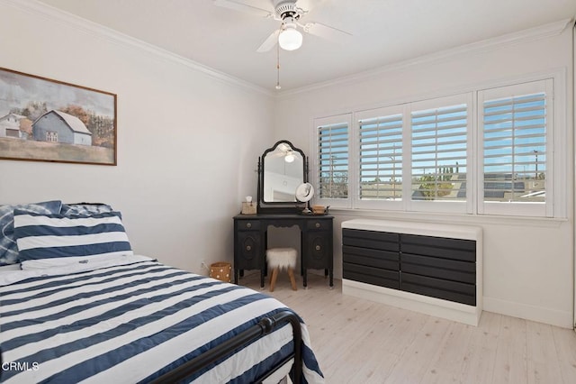 bedroom with ornamental molding, light hardwood / wood-style floors, and ceiling fan