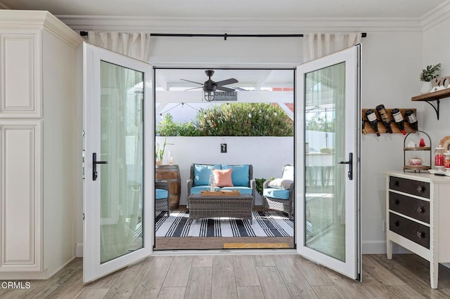 doorway to outside with french doors, ceiling fan, crown molding, and light hardwood / wood-style flooring