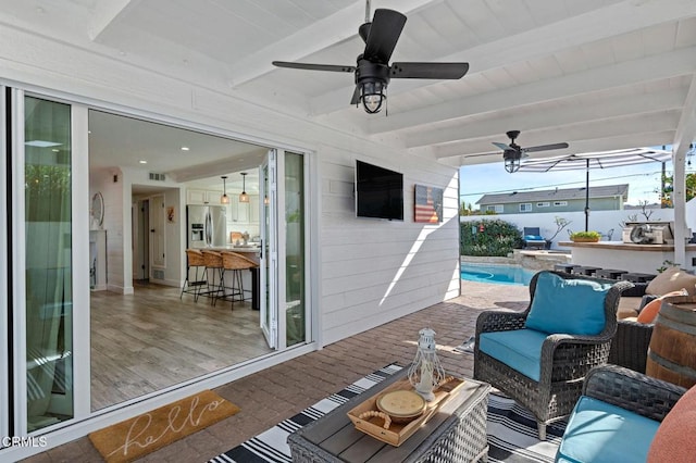 view of patio with an outdoor hangout area and ceiling fan