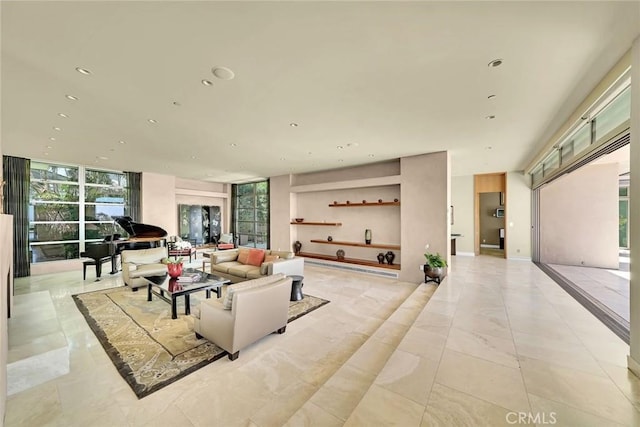 living room with floor to ceiling windows