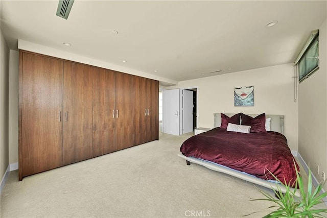 bedroom featuring light colored carpet