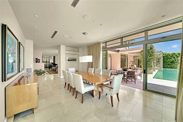 dining room with a wall of windows