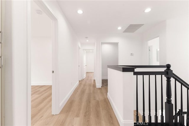 corridor featuring light hardwood / wood-style floors