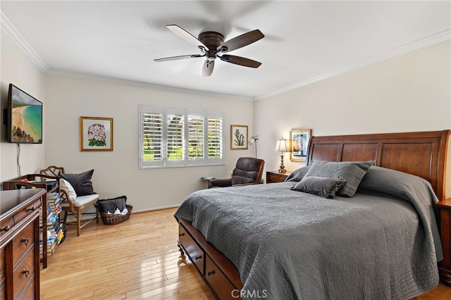 bedroom with ceiling fan, ornamental molding, and light wood-type flooring