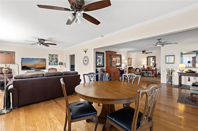 dining area featuring ornamental molding and hardwood / wood-style floors