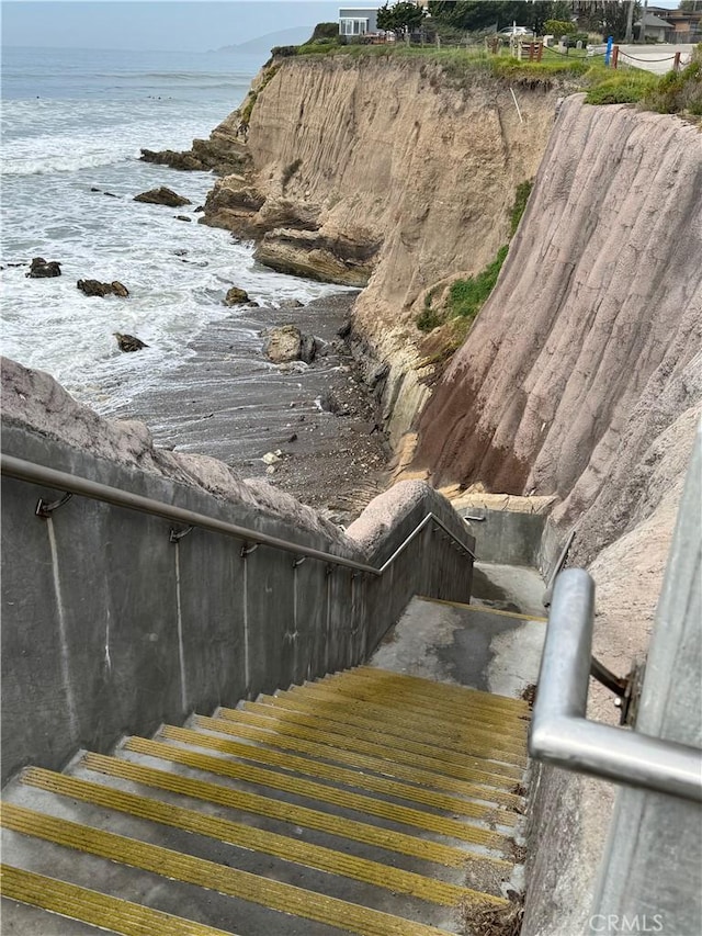 stairway featuring a water view