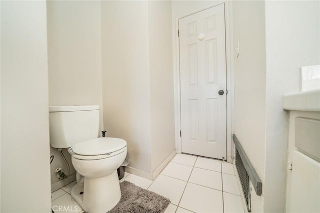 bathroom featuring tile patterned flooring and toilet