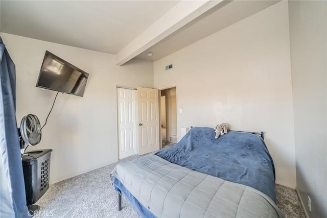 carpeted bedroom featuring beam ceiling