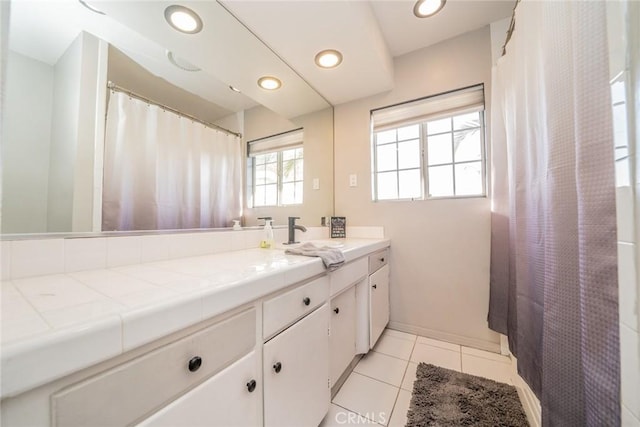 bathroom with vanity and tile patterned floors